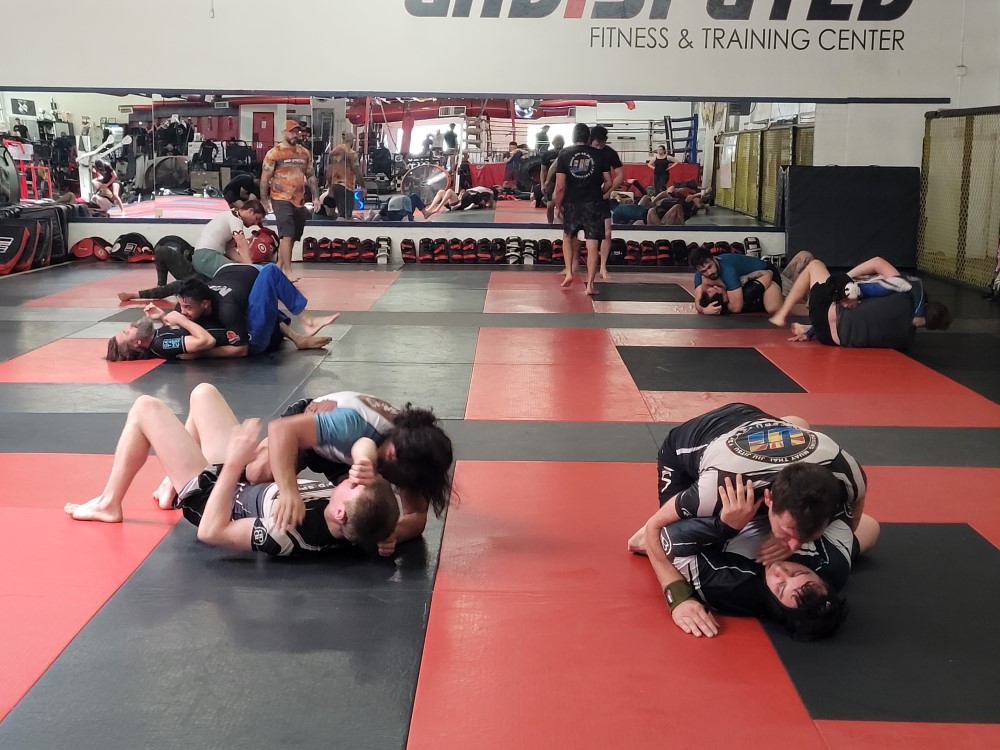 My friend on the right grappling with somebody else during Brazilian Jiu-jutsu class!